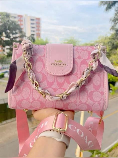 imitation coach bag pink